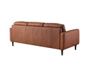 Rear three-quarter view of the Armando sofa, showcasing the smooth leather back panel, the profile of the arm, and its four dark tapered legs.
