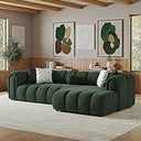  Bella 114-inch dark green French bouclé right-facing sectional sofa with curved channel-tufted cushions and accent pillows in a modern living room.