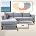 Bianca 97-inch grey fabric left-facing sectional sofa with plush cushions and tapered wooden legs in a modern living room.