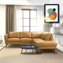 Bianca 97-inch tan genuine top-grain leather right-facing sectional sofa with tapered wooden legs in a modern living room setting styled with a round coffee table and beige rug.