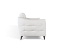 A side profile view of the Bianca contemporary sofa, showcasing the white leather upholstery, horizontal channel-tufting on the side panel, and the gentle curve of its backrest.