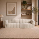 Burntwood 114-inch light brown chenille power slider sofa with vertical channel tufting in a modern neutral living room.