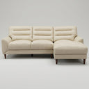 Chiara 97-inch cream genuine leather sectional sofa with right-facing chaise lounge, channel-tufted back cushions, and dark tapered wood legs.
