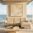 Chiara 97-inch cream genuine leather sectional sofa with right-facing chaise and horizontal channeled back cushions in a modern coastal living room with ocean views.