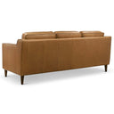 Three-quarters rear view of the Cooper mid-century modern tan leather three-seater sofa with track arms and tapered wooden legs, isolated on a white background.