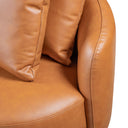 Close-up of the Dina 85-inch modern cognac leather sofa with a pillow on a white background.