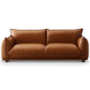 Elena 89-inch mid-century modern cognac genuine leather sofa with plush cushions and low wooden feet, isolated on a white background.