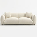 Elena 89-inch mid-century modern cream boucle sofa featuring a plush low-profile design, matching pillows, and tapered wood legs, isolated on a white background.