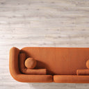Top view of the Elissa 93-inch Japandi burnt orange boucle sofa featuring a curved, low-profile design and matching spherical pillows.