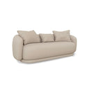 A three-quarter view of the Ellie sofa, highlighting its continuous curved silhouette, soft linen texture, and its recessed, floating-style base.