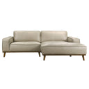 Front view of the Katia 98-inch right-facing sectional sofa in beige leather, featuring wide track arms, piped cushions, a spacious right-side chaise lounge, and a dark wood base with angled tapered legs against a white background.
