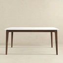 Front view of the Lina 60-inch modern rectangular dining table featuring a sleek, beveled white tabletop supported by a dark brown wood frame with tapered legs, set against a neutral textured beige backdrop.
