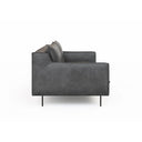 A side view of a black leather Linea Sofa with a minimalist design, featuring a sleek backrest and seat with metallic accents.