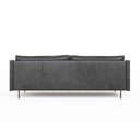 A rear view of a black leather Linea Sofa with a minimalist design, featuring a sleek backrest and seat with metallic accents.