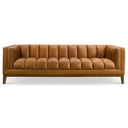 Mia 90-inch mid-century modern cognac vegan eco-leather sofa with vertical channel tufting, shelter arms, and tapered wooden legs, isolated on a white background.