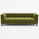 Mia 90 mid-century modern olive green velvet tuxedo sofa with vertical channel tufting and tapered wooden legs against a white background.
