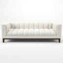 Mia 90 Mid-Century Modern white boucle sofa featuring vertical channel tufting on the seat, backrest, and arms, supported by a dark wood frame with tapered legs, shown from the front against a clean white studio background.