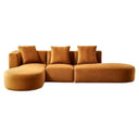 Olga 130-inch cognac velvet left-facing modular sectional sofa with rounded curved chaise ends and three matching accent pillows on a white background