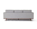 Back view of a gray upholstered Olwyn Sofa with a full wood base and wide track arms, presented against a white background.