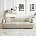 Stacey 87-inch cream luxury fabric sofa with matching throw pillows set on a geometric patterned rug in an elegant room with classic wall molding.
