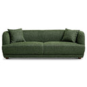 Modern Stacey 87-inch sofa upholstered in textured deep green fabric featuring rounded arms, matching throw pillows, and low wooden legs against a plain white background.