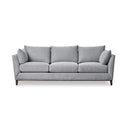 A front view of a gray upholstered Taylor Sofa with subtly curved arms, a solid European beech hardwood base, and tapered dark brown legs.