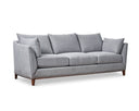 A gray upholstered Taylor Sofa with subtly curved arms, a solid European beech hardwood base, and tapered dark brown legs.