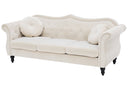 Beige sofa with decorative pillows on a white background
