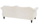 Backside of a beige sofa with black legs on a white background